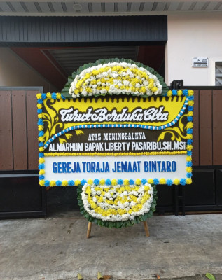 Papan Bunga Duka di Mario