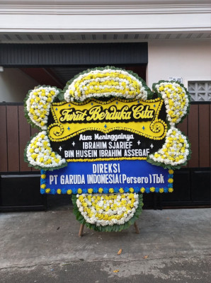 Papan Bunga Duka di Mario